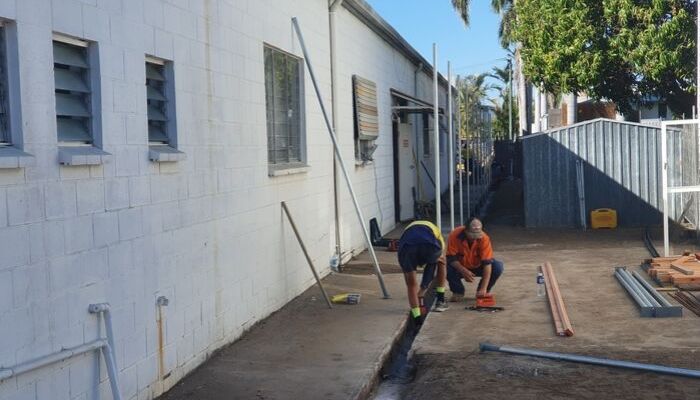 Construction worker in Townsville repairing building
